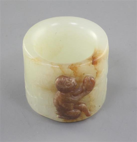 A good Chinese pale celadon and russet jade archers ring, 18th/19th century, height 2.5cm, diameter 2.8cm